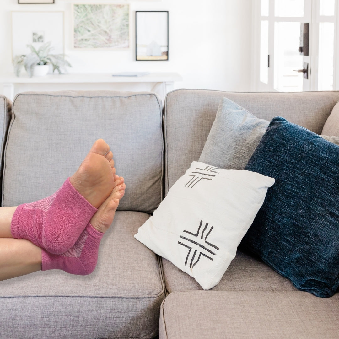 Relaxing on the Couch wearing Cracked Heel Socks